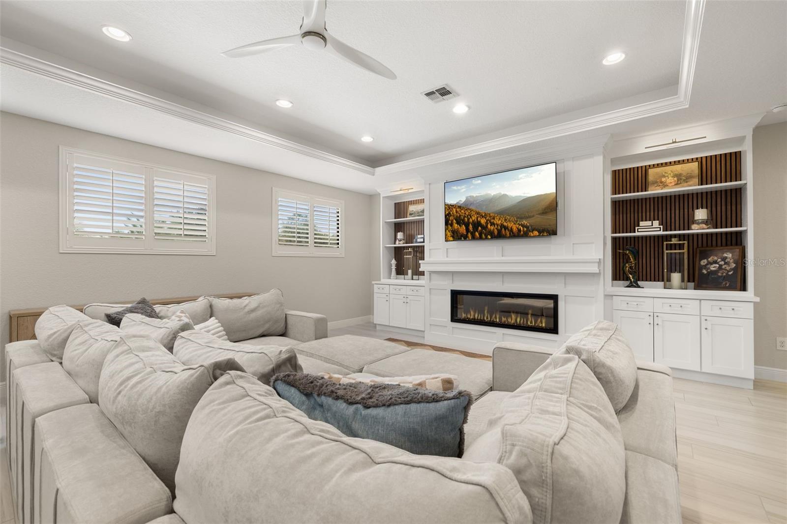 Custom cabinetry and tray ceiling