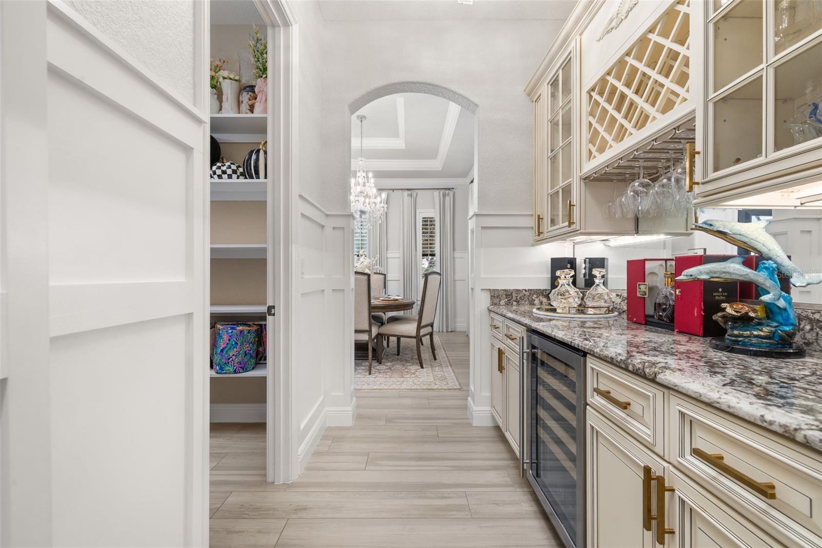 Butler's pantry leading from kitchen to dining room