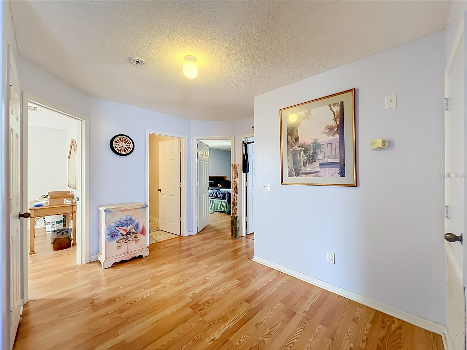 Beautiful wood laminate floors lead to 3 bedrooms on 2nd floor