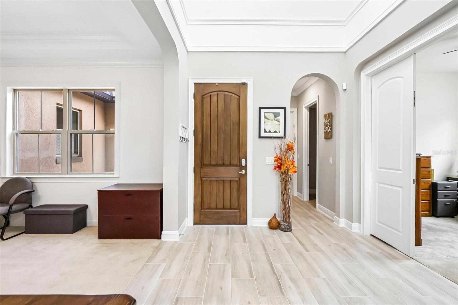 Front Foyer. Views of In-Law Suite Hall, Office, and Dining.