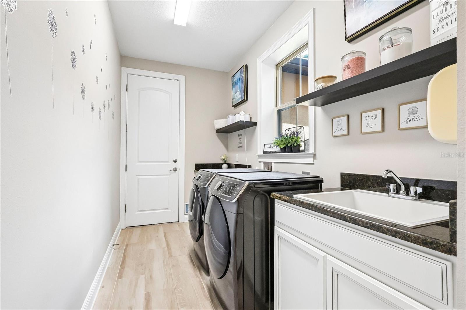 Laundry with Entry into Both Garages