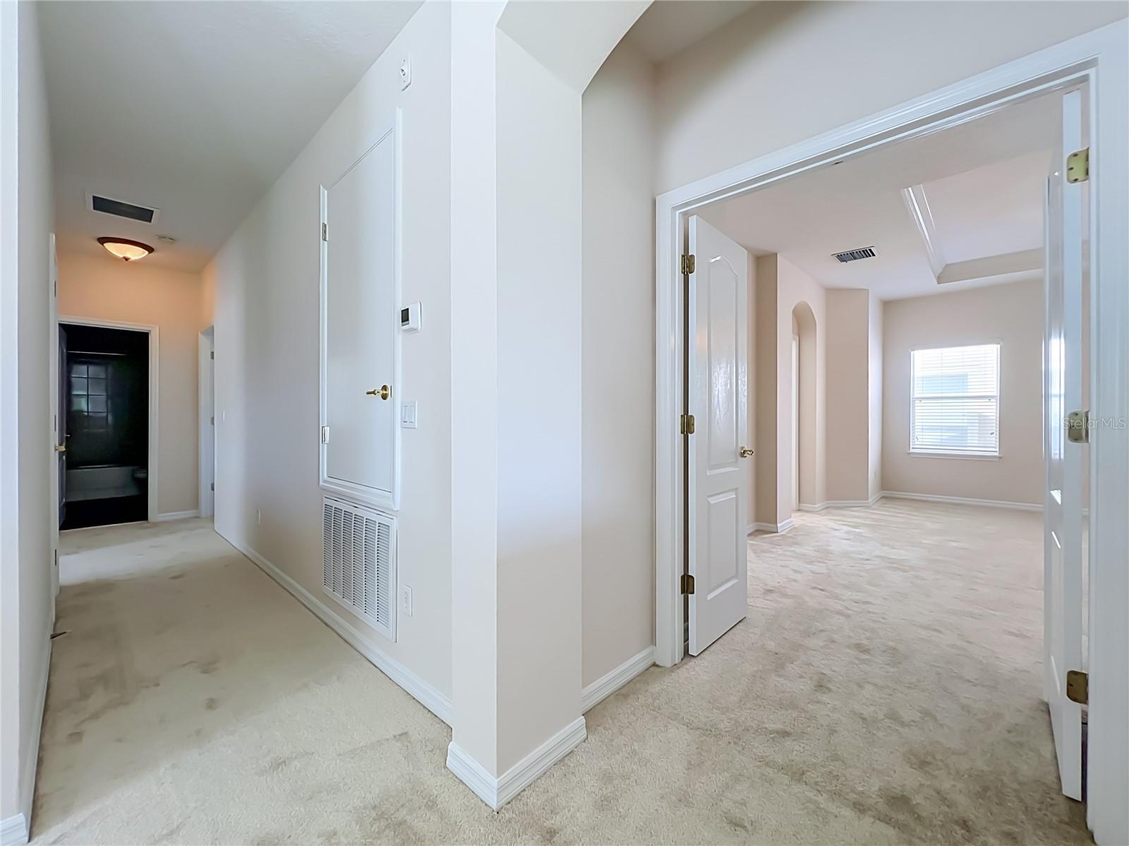 Primary bedroom with french door entry
