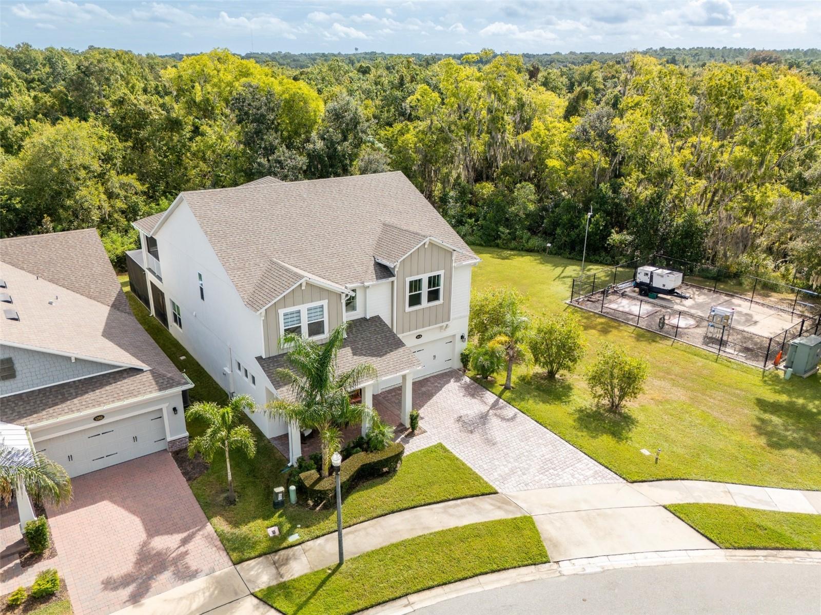 Aerial view showcasing conservation surroundings with no rear neighbors or neighboring home on the right.