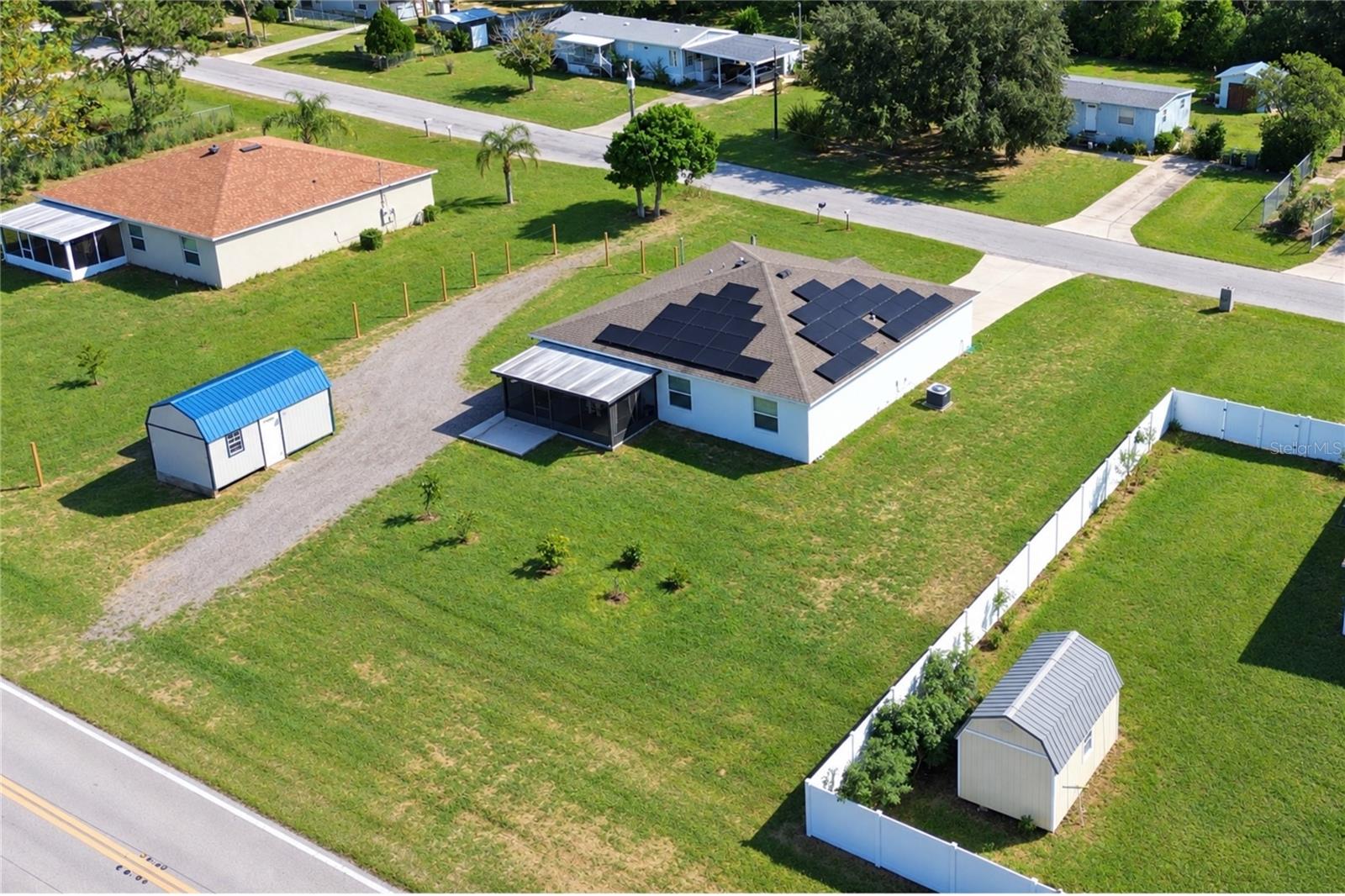 Aerial view of the property and its surroundings from another angle.