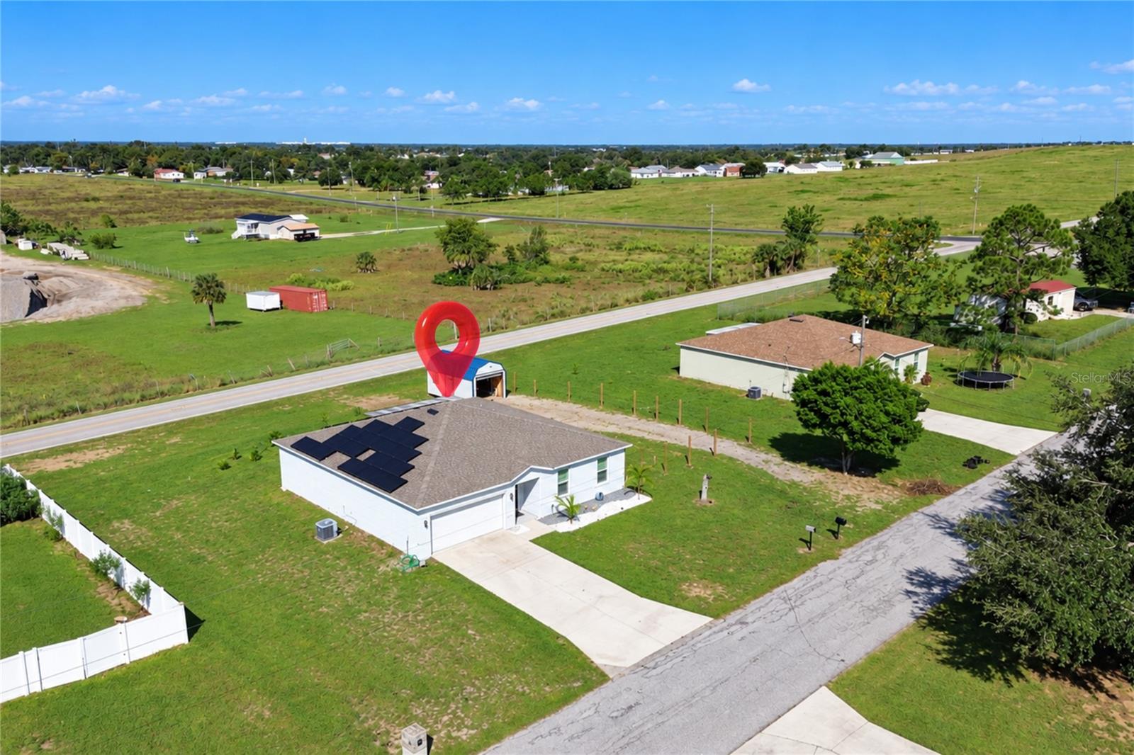 Aerial view showcasing the property and its spacious lot.