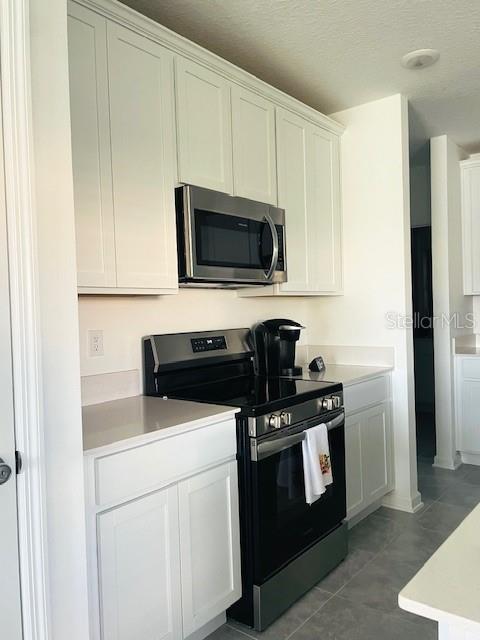 Beautiful White kitchen Cabinets & front-control Electric Range