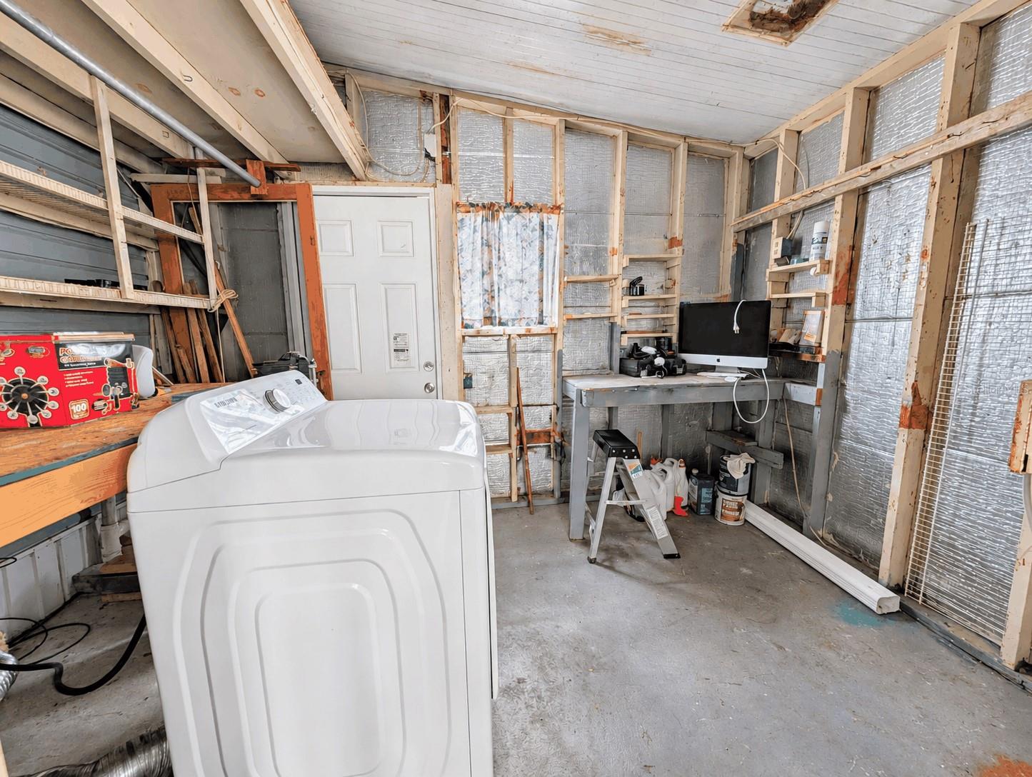 Back storage room behind side screened porch