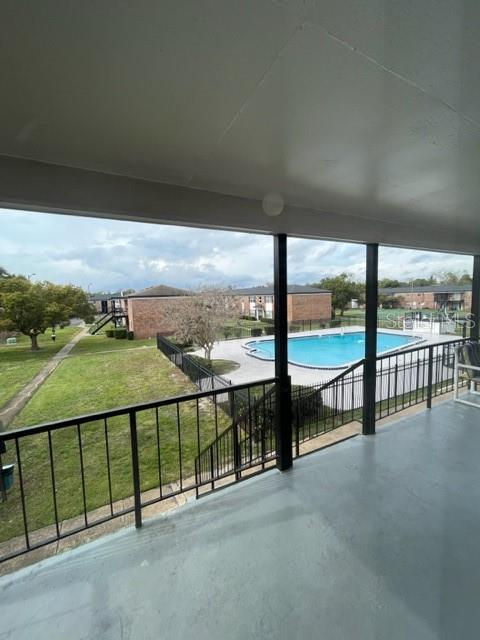 Balcony with pool and common space view
