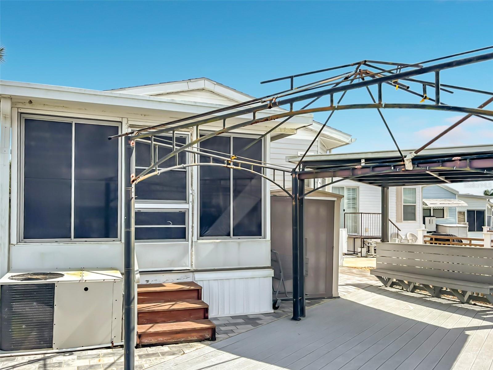 Expansive trex deck overlooks the canal to the rear of thr property