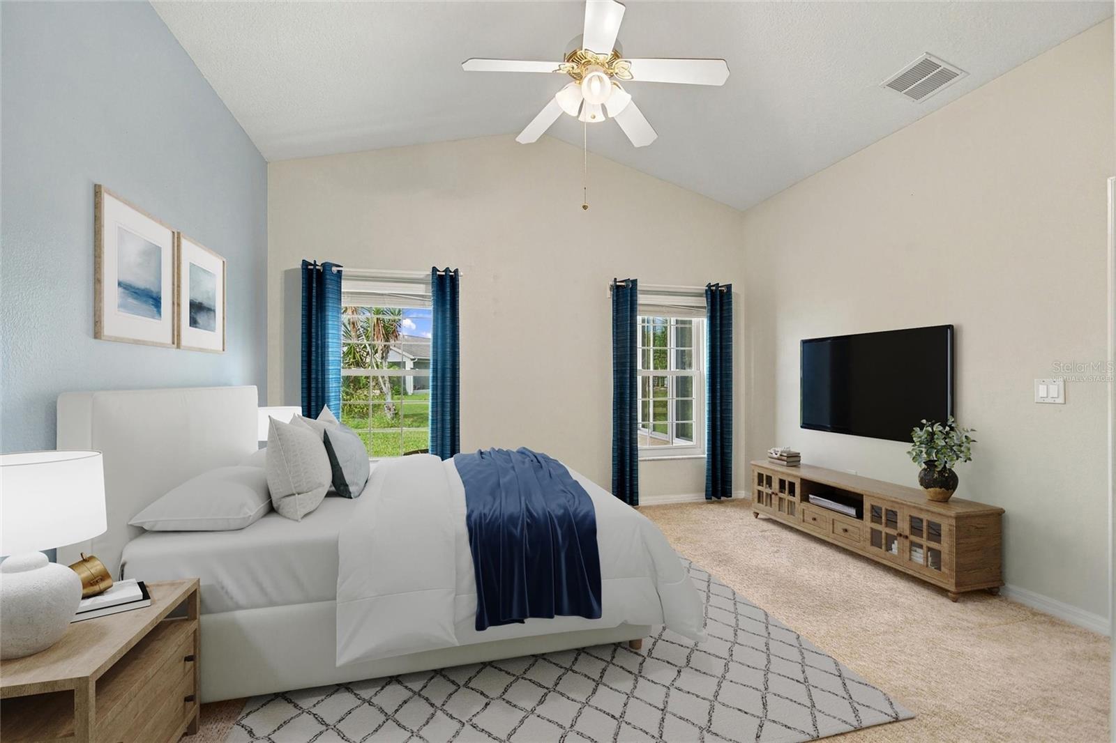 Virtually staged primary en suite bedroom in back of house