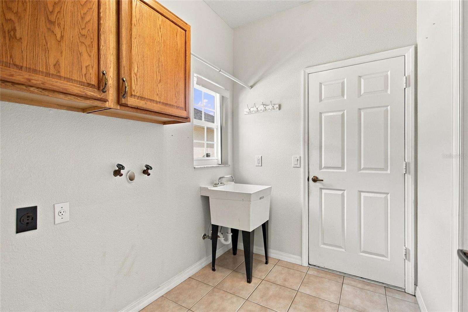 Laundry room has corridor access to garage