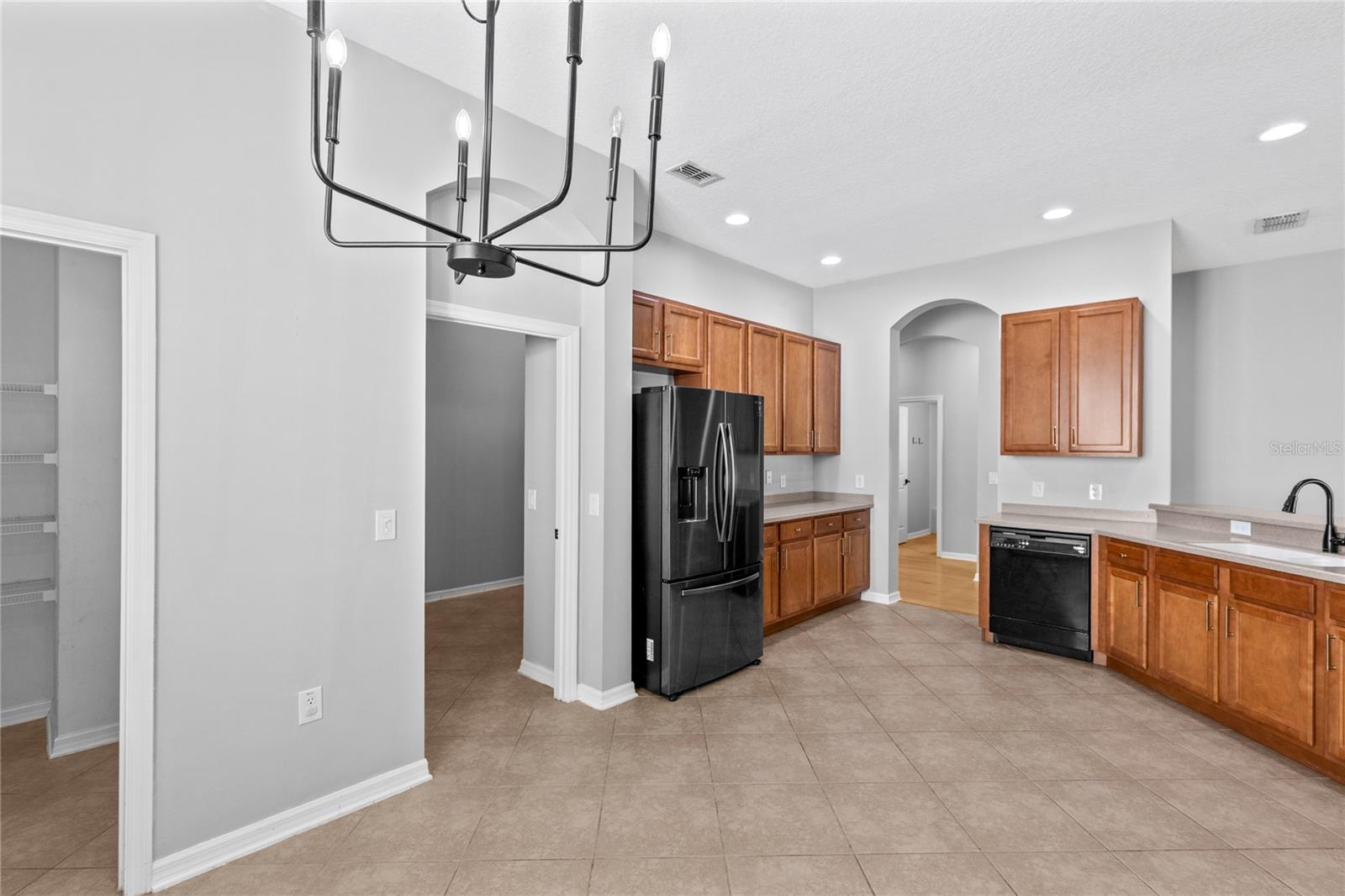 Kitchen showing pantry and laundry room
