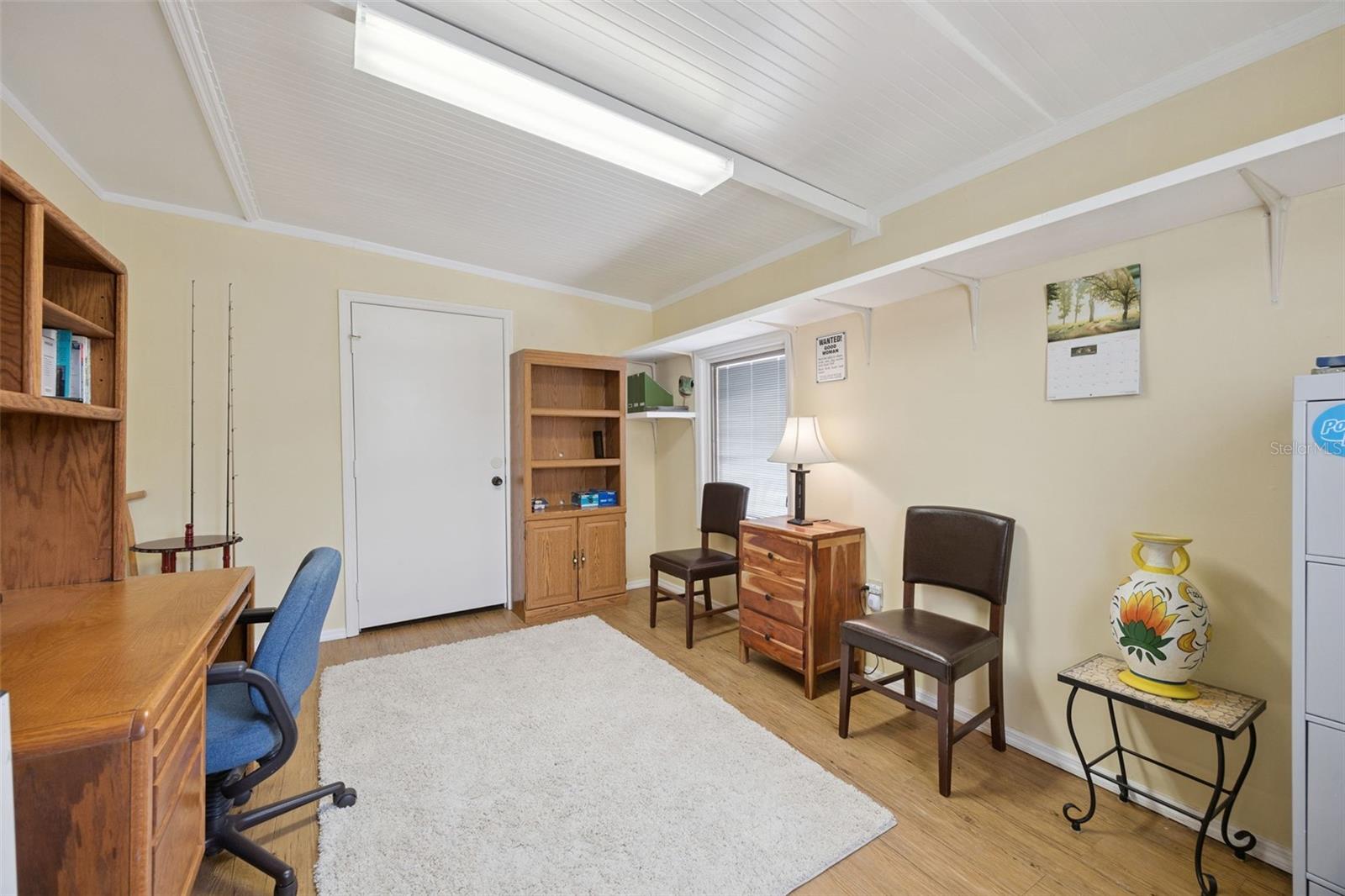 Multi-Purpose Flex Room: Versatile flex room ideal for a home office, den, or craft space, complete with durable flooring and plenty of wall storage space.