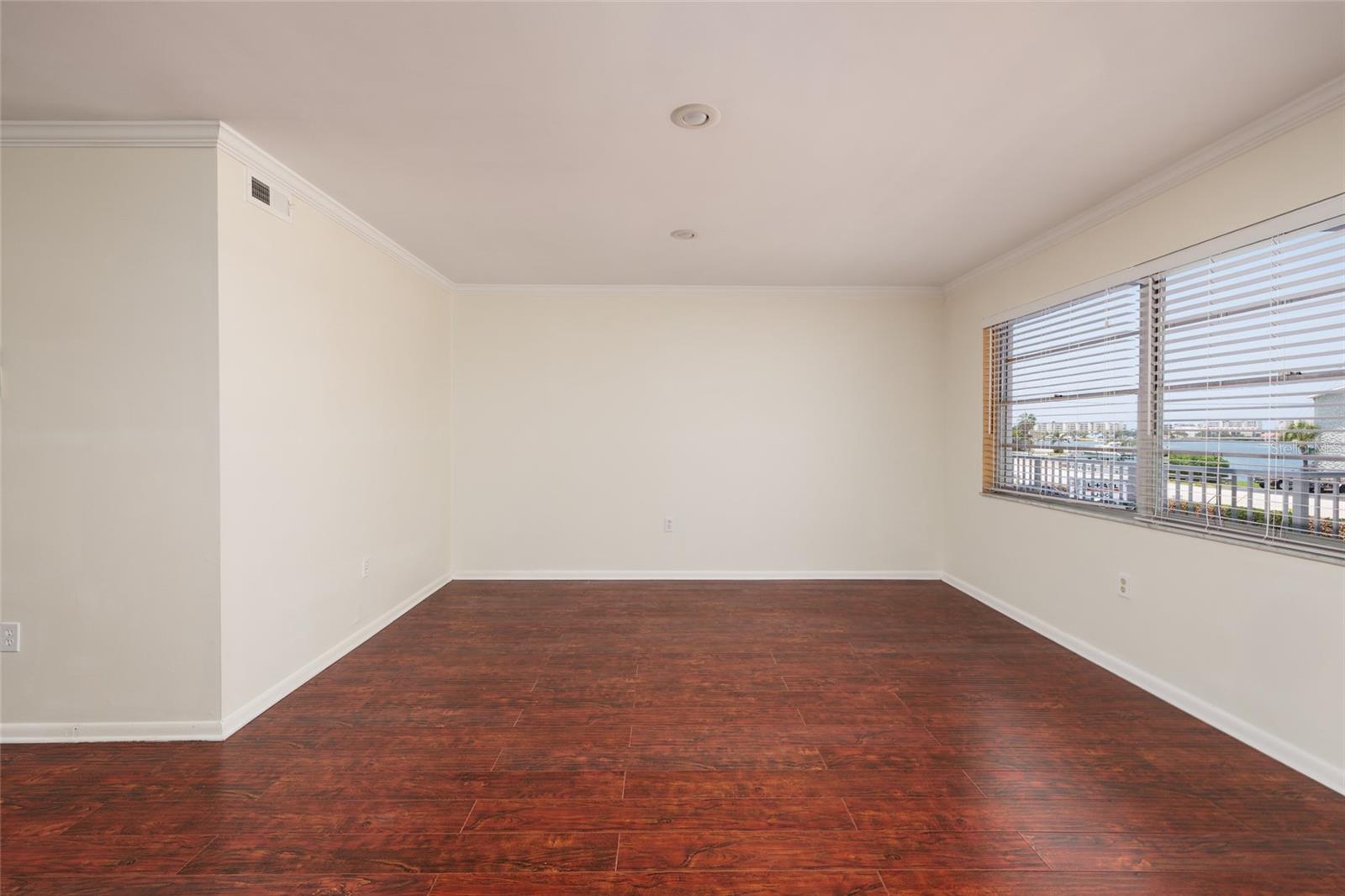 Living Room w/Crown Molding, recessed lighting & Bay views. 18' x 13'. Living Room w/Crown Molding, recessed lighting & Bay views. 18' x 13'.