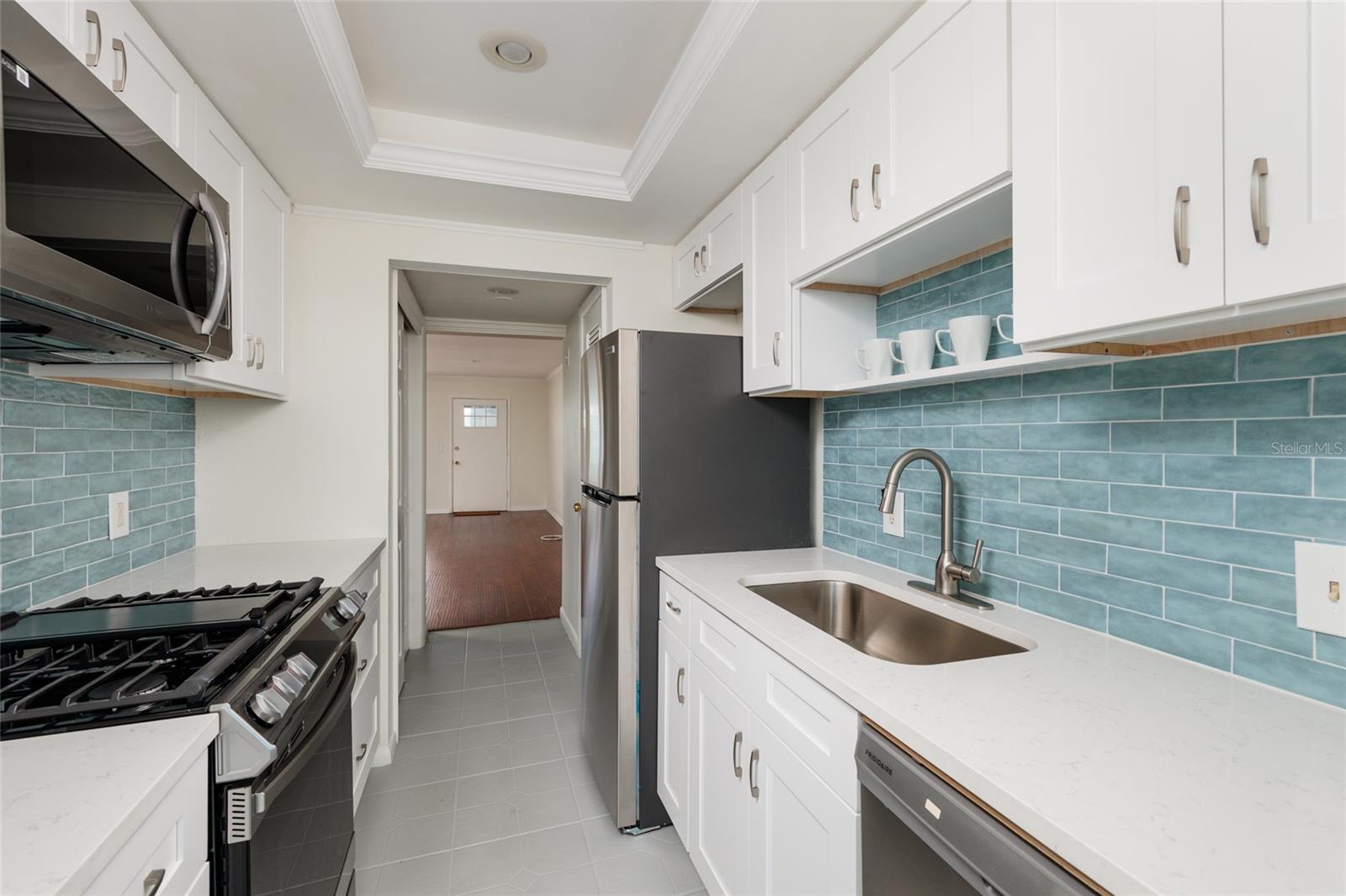 New appliances. Quartz counters. Closet pantry & extra storage closet. Tray ceiling. New appliances. Quartz counters. Closet pantry & extra storage closet. Tray ceiling.