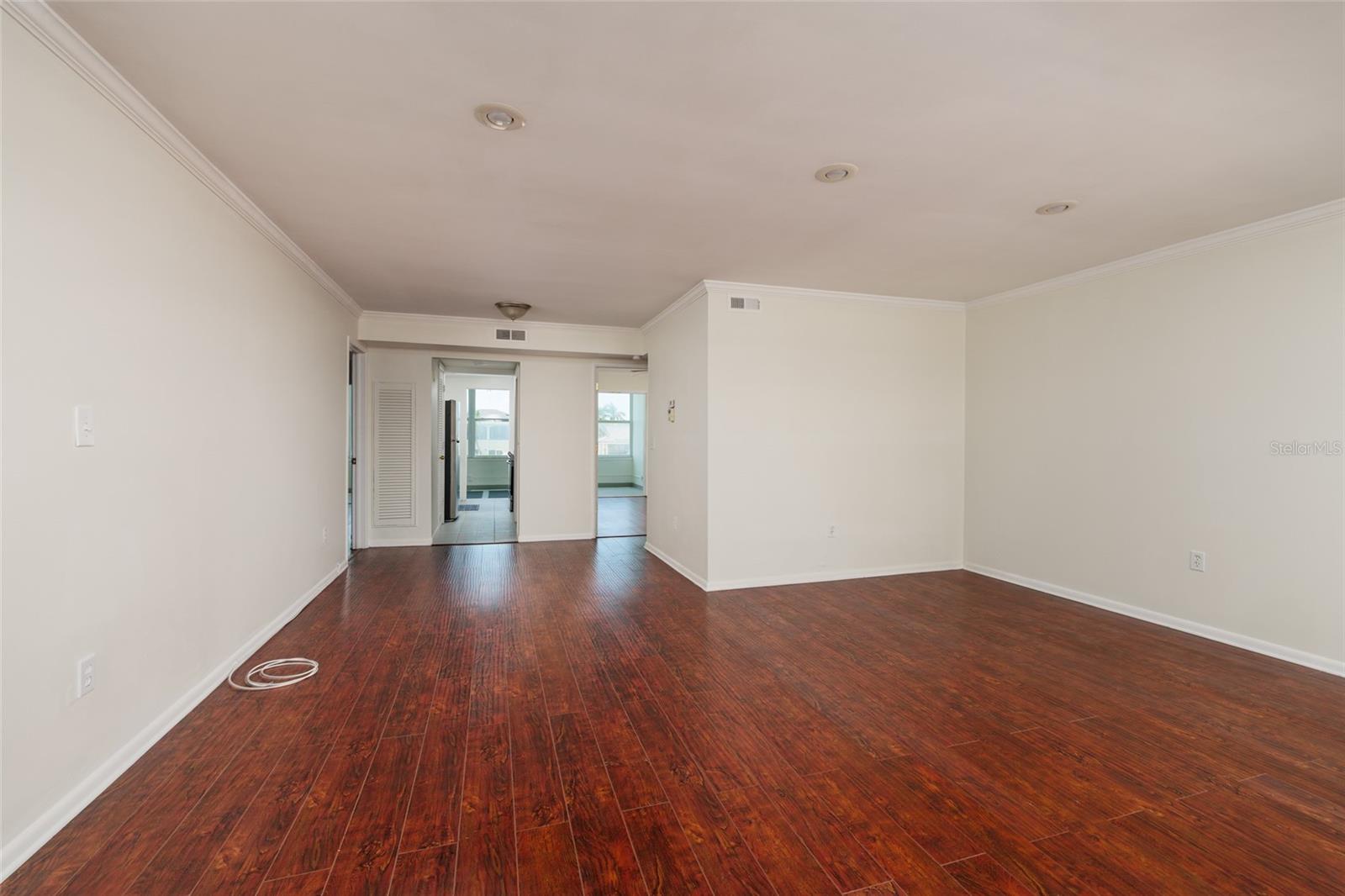 Living & Dining areas: High end laminate flooring & crown molding. Living & Dining areas: High end laminate flooring & crown molding.