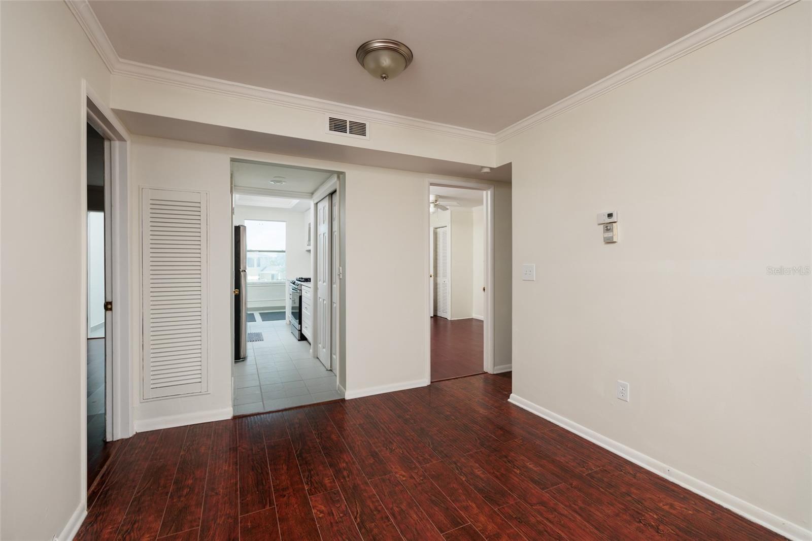 Dining Area w/Crown Molding. 9'x 8'. Kitchen in middle & bedrooms on both sides. Bathroom on right side of dining area. Dining Area w/Crown Molding. 9'x 8'. Kitchen in middle & bedrooms on both sides. Bathroom on right side of dining area.