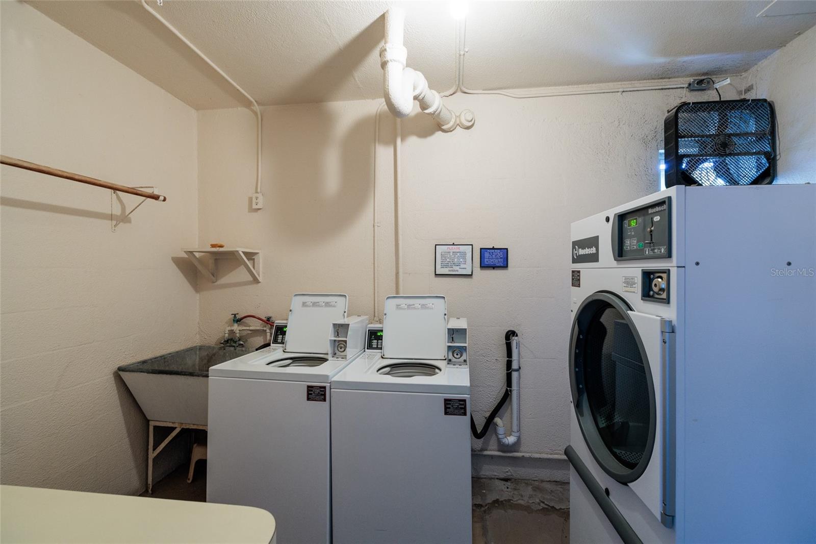 Each floor has a Laundry room by the elevator. Outside shared storage room is next door.