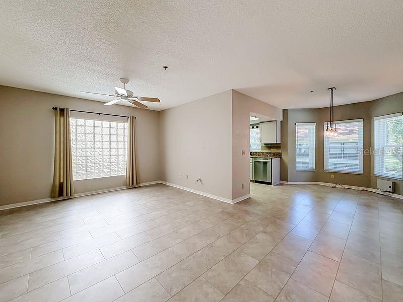 Spacious living room looking into dining area and kitchen