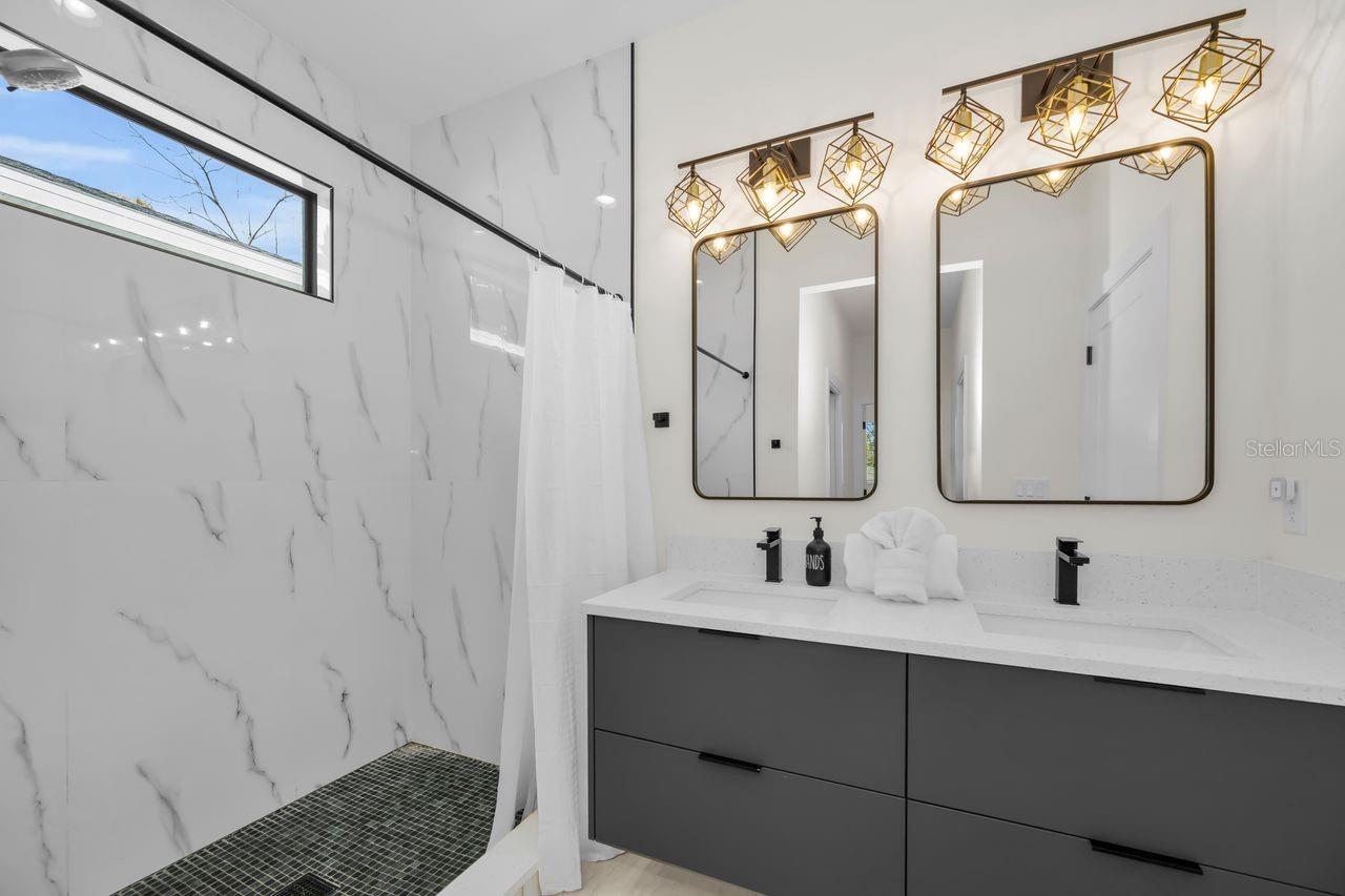 Clean, sleek, and modern primary bath