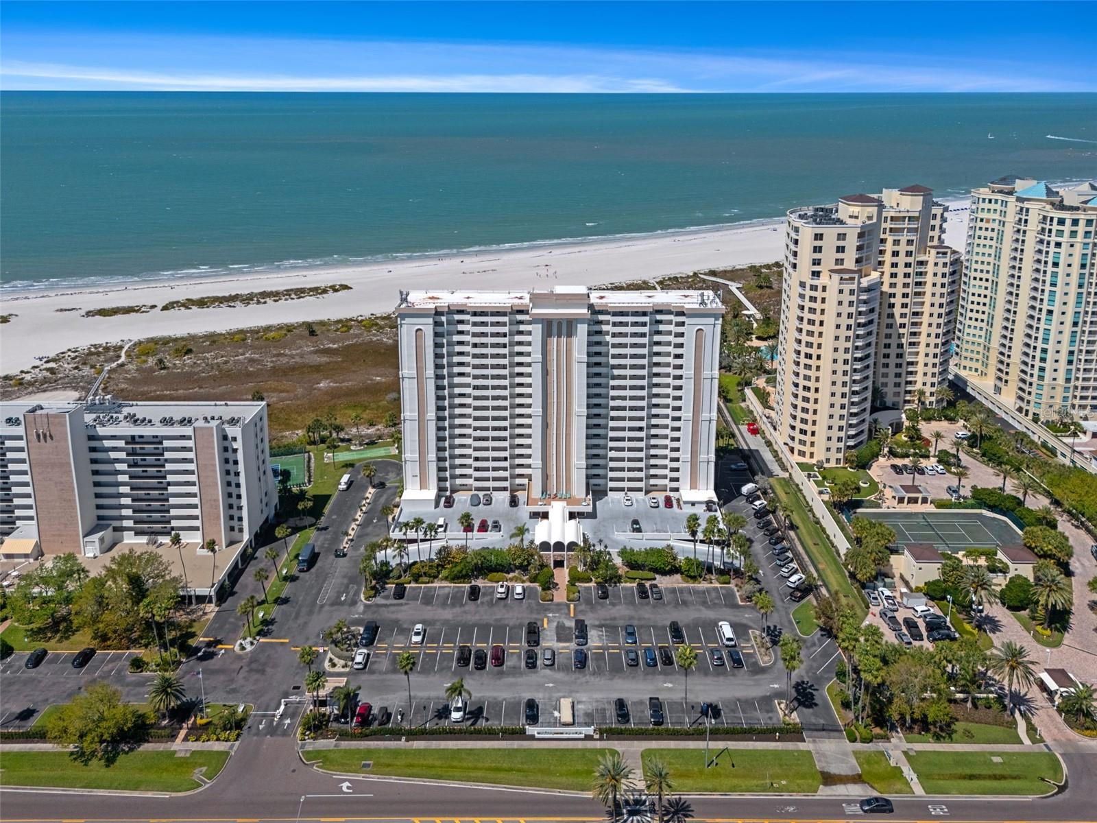 Aerial showing other similar residential properties along the beach