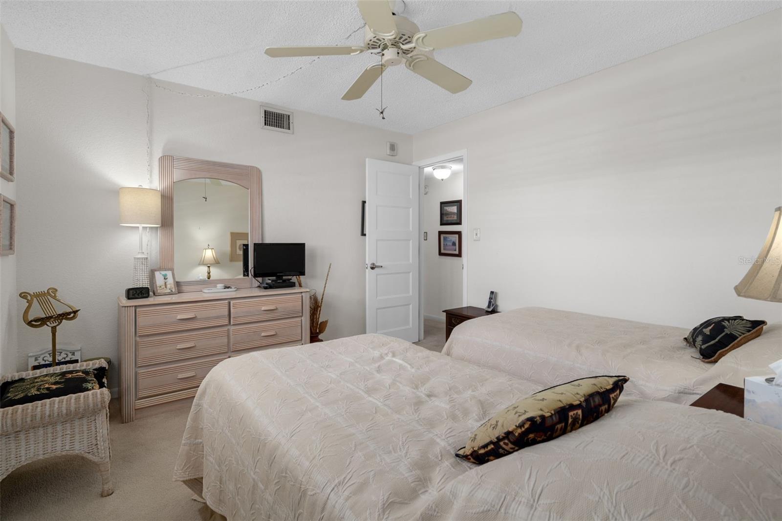 Bedroom 2 is equipped with twin beds for overnight guests