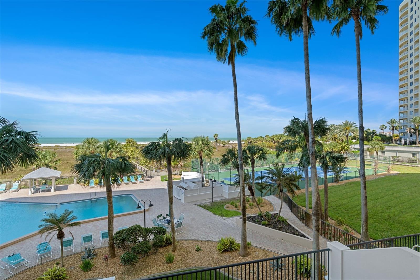 View from patio of 303.  Notice the beautifully maintained grounds and amenities
