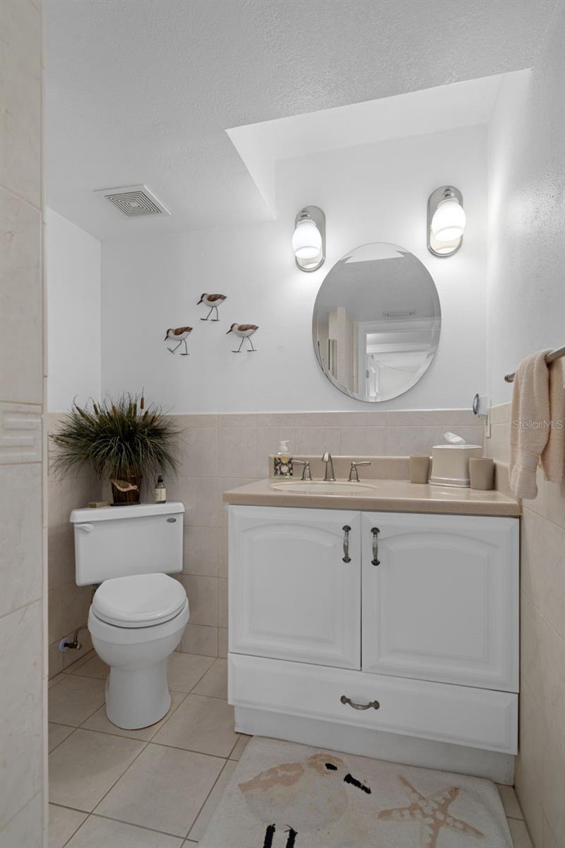 Guest bathroom is located in the hallway just across from bedroom 2