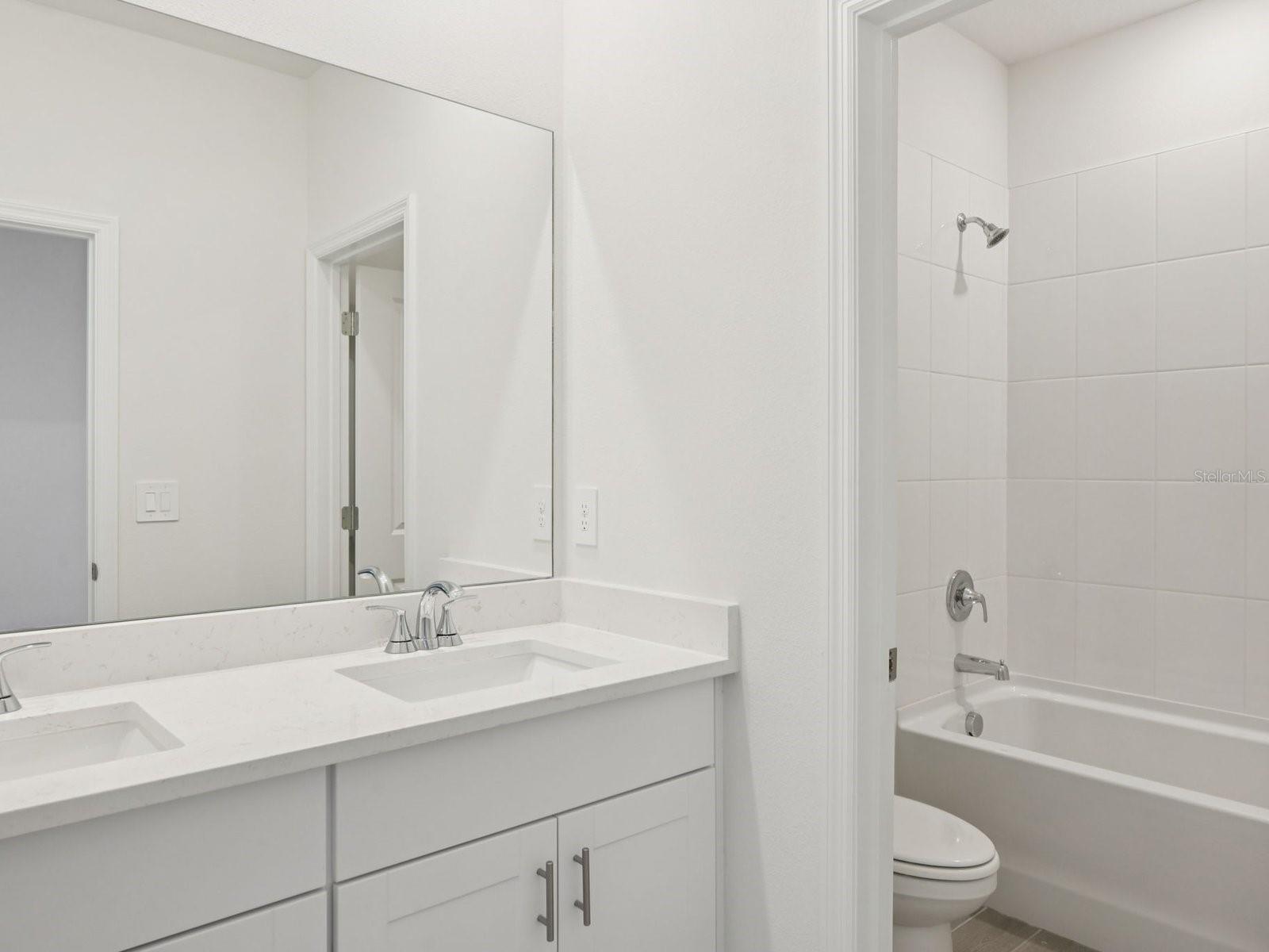 Interior photos are not of the actual home but are photos of the builder home with the same floorplan with similar interior finishes and features.