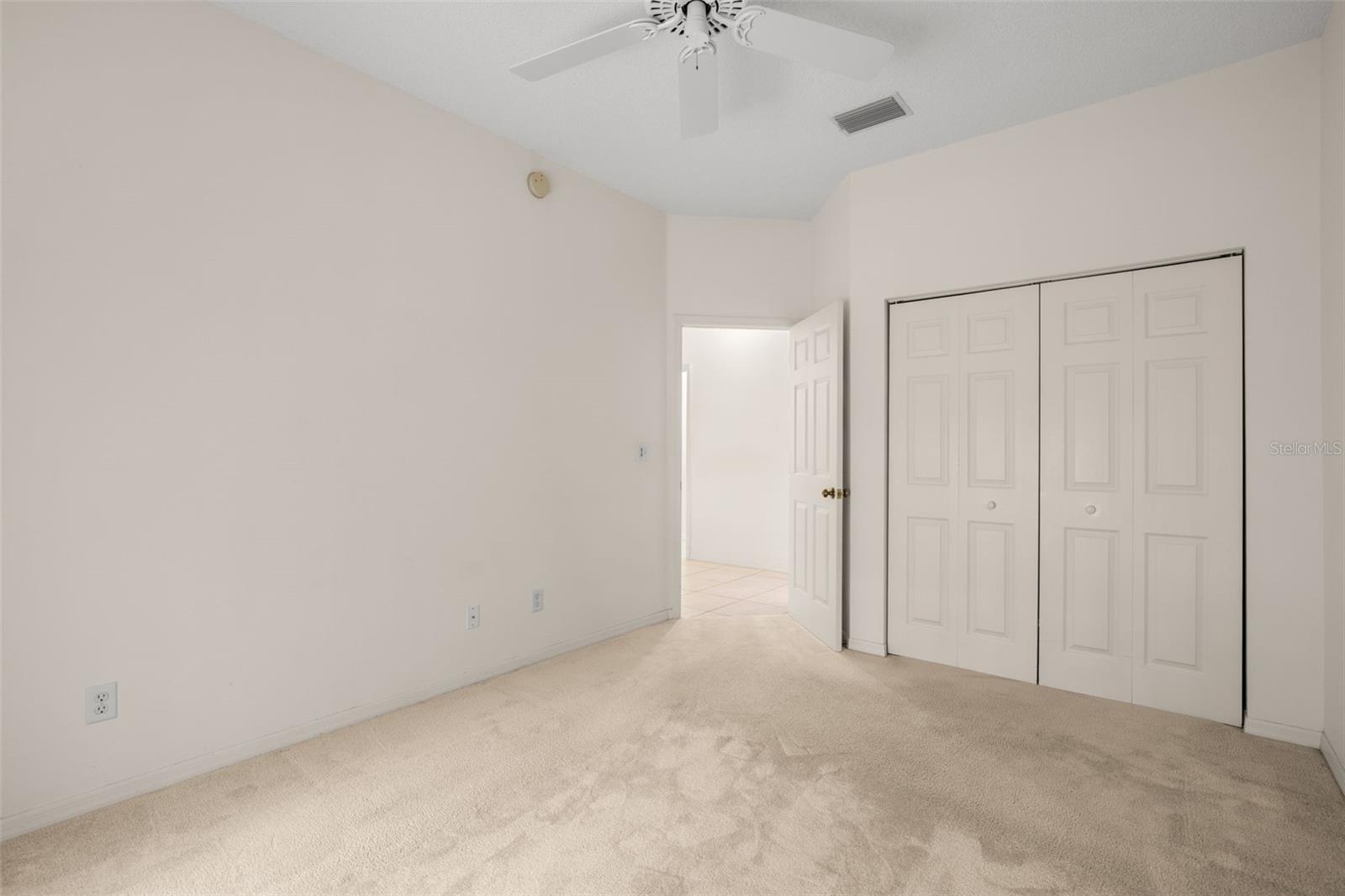 Bedroom with a built-in closet and clean, neutral finishes, providing practical storage and flexibility for a variety of uses.