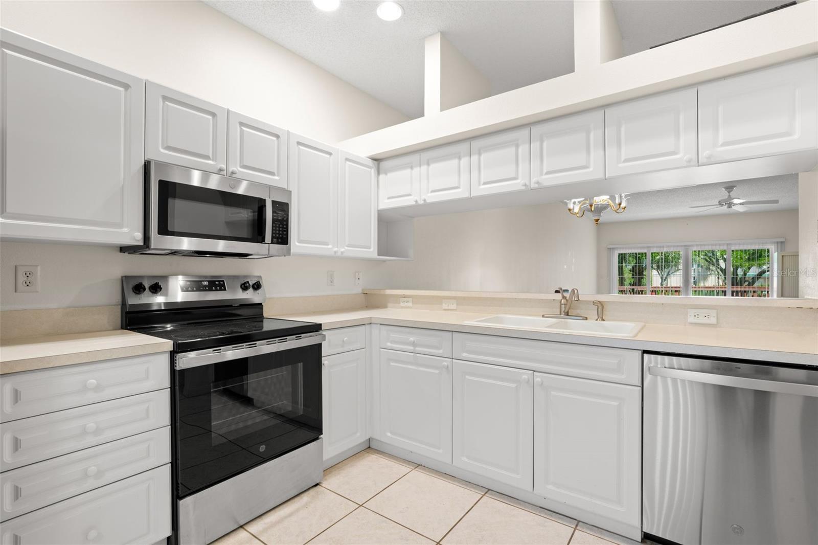 Functional kitchen with extended breakfast bar and pass-through to the living room, creating an open connection ideal for everyday living and entertaining. Functional kitchen with extended breakfast bar and pass-through to the living room, creating an open connection ideal for everyday living and entertaining.