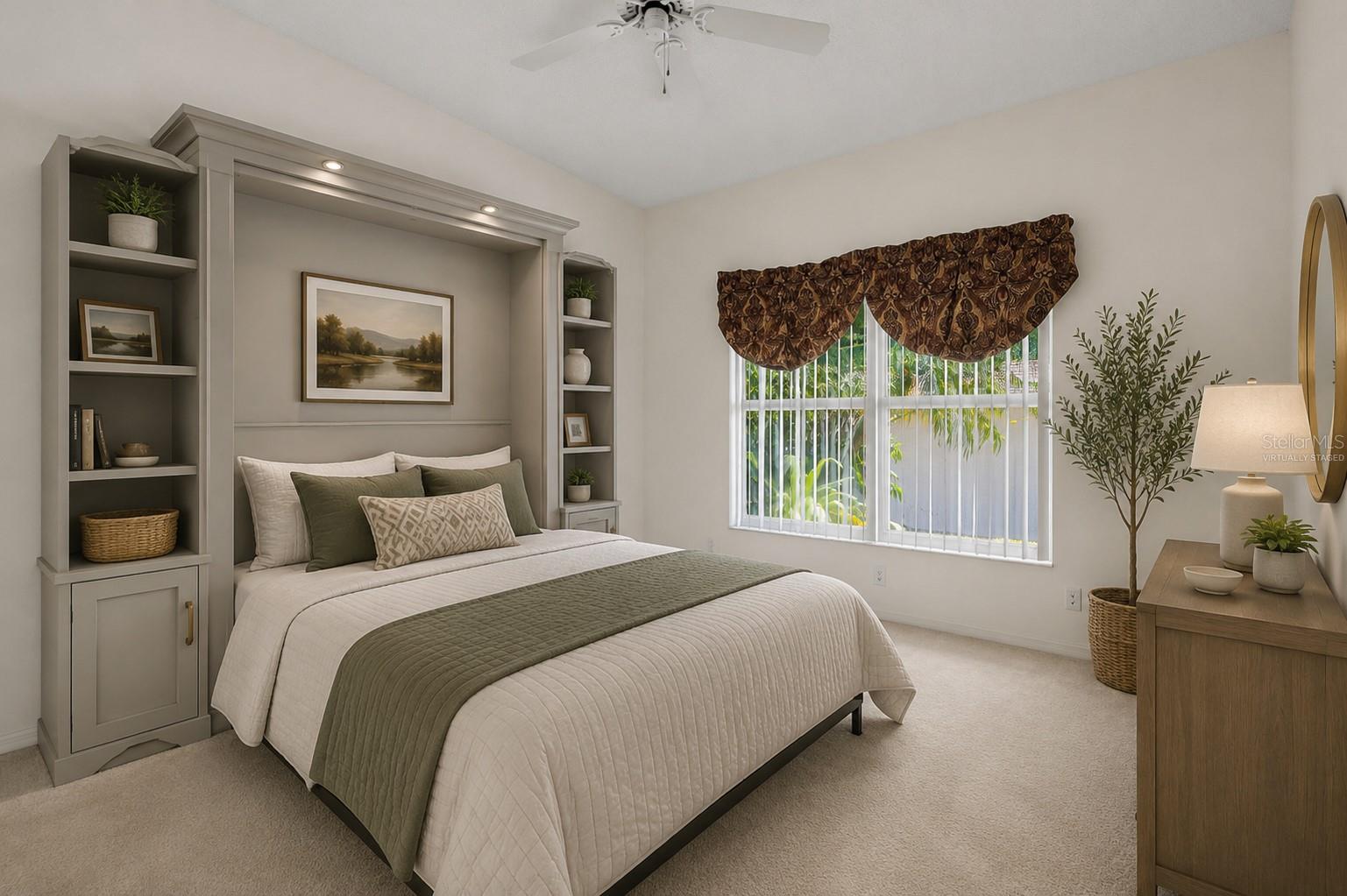Bedroom 3 featuring a large window for natural light, carpeted flooring, neutral tones, and a ceiling fan, offering a comfortable and adaptable layout. This photo has been virtually staged.