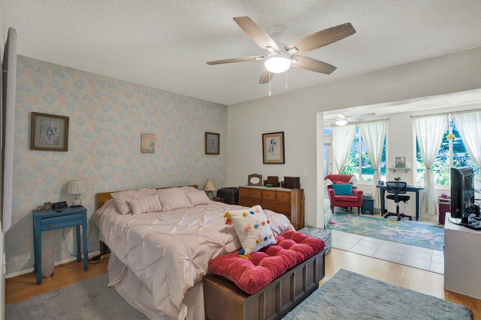 Spacious-Primary-Bedroom-Accent-Wallpaper-Ceiling-Fan-Clearwater-FL