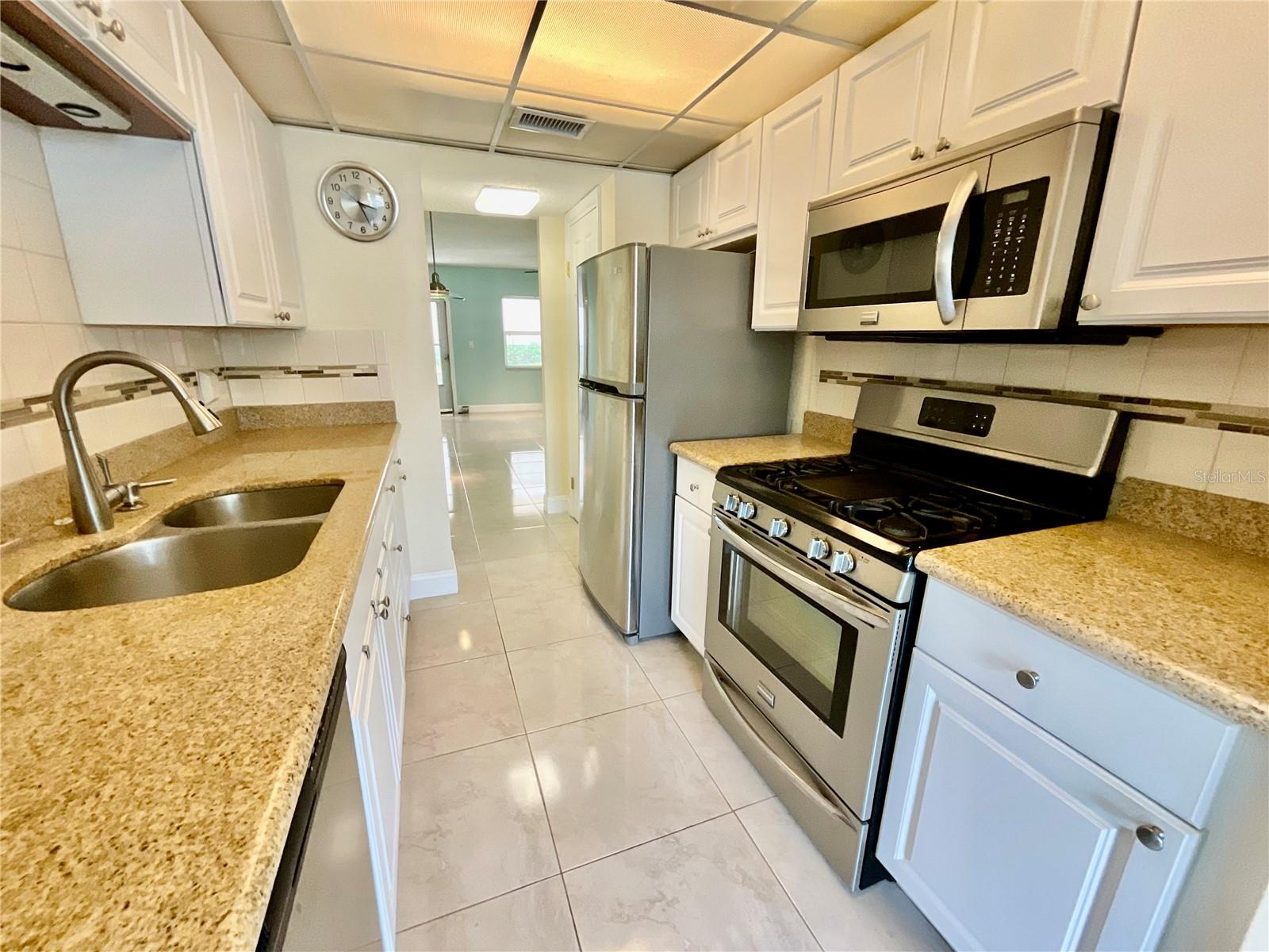 Galley Kitchen with all electric appliances, ample cabinets/space and a separate, doored pantry Galley Kitchen with all electric appliances, ample cabinets/space and a separate, doored pantry