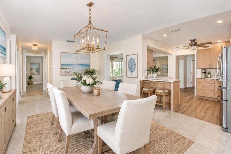 Virtually staged dining room connected to kitchen