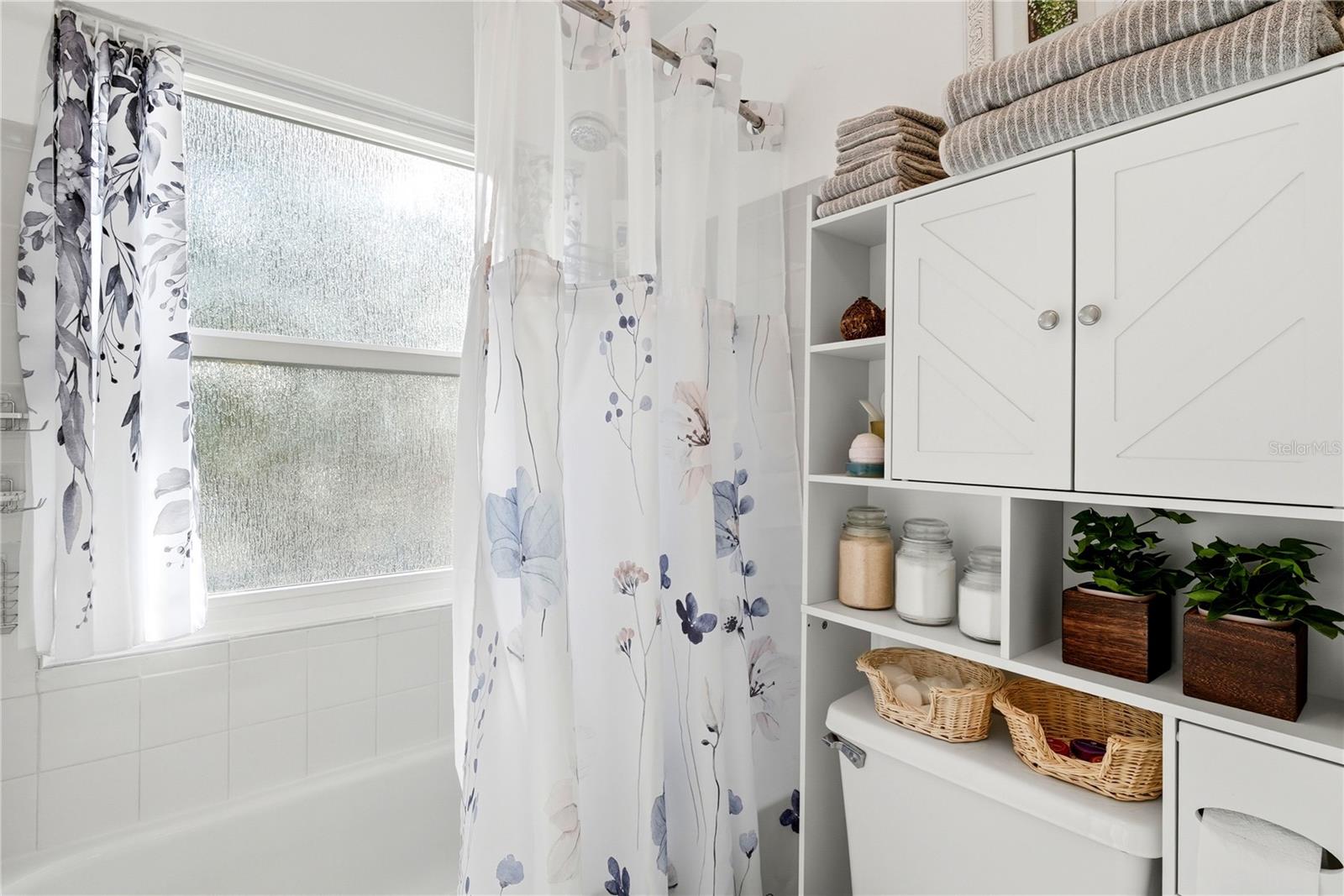 Bathroom with Tub. Door Separates Dual Sink Area. Making Getting Ready for Work Easy!