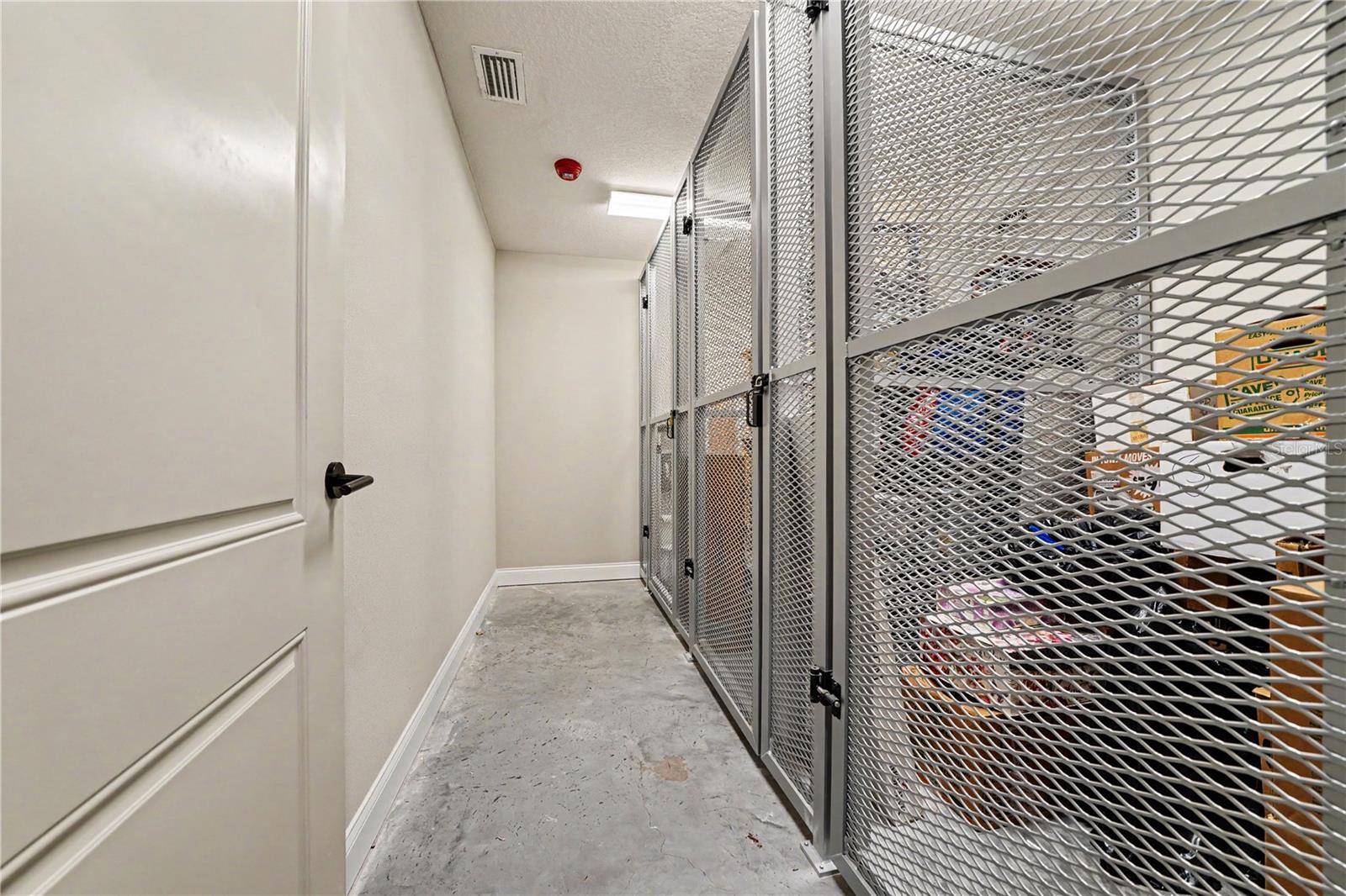 Private storage unit (first one at the end/left side of photo).  Located adjacent to garage entrance