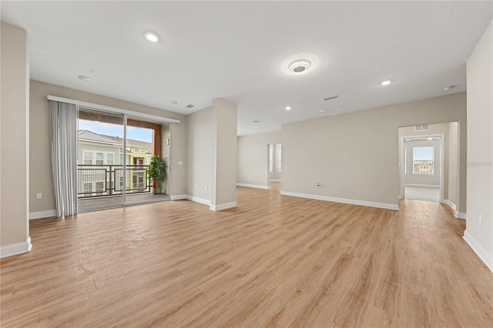 A great room with luxury vinyl flooring and an abundance of room for designing your space