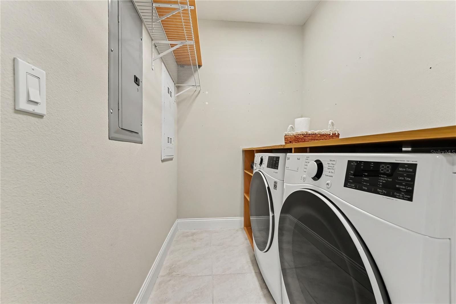 Laundry room with high end washer and dryer that convey