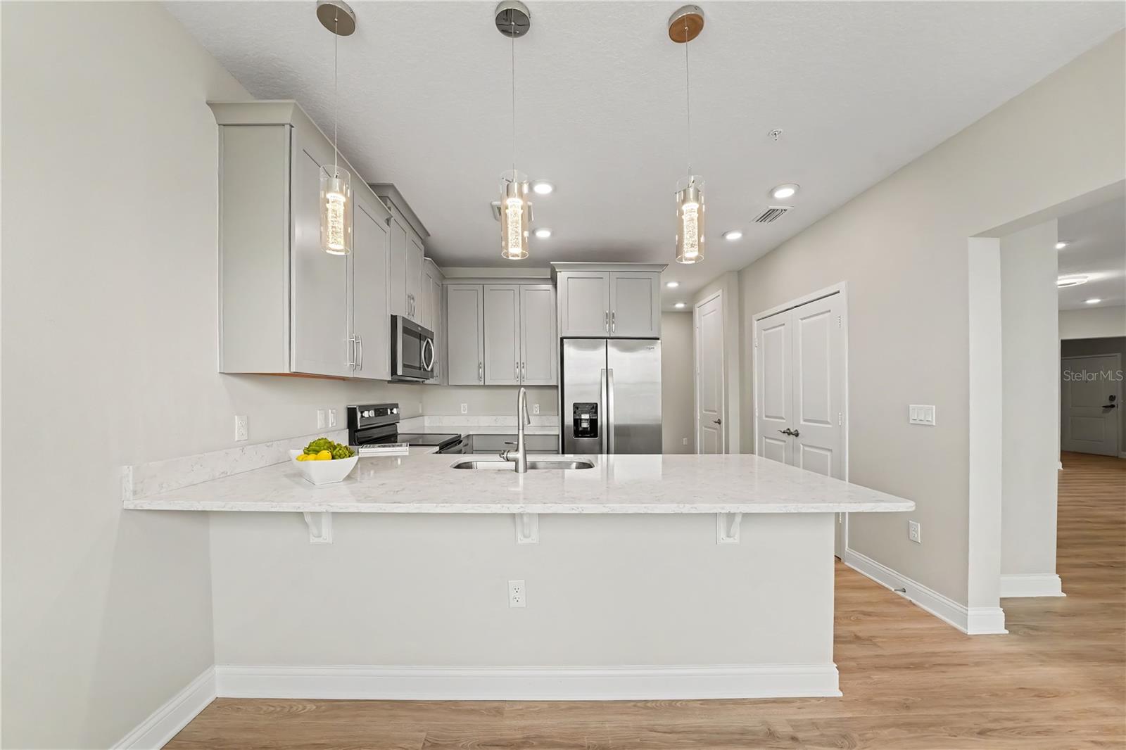 Freshly painted condo with neutral tones that compliment the cabinetry and counters