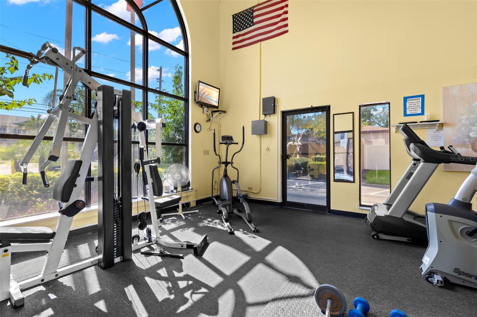 The community fitness center is equipped for both cardio and strength training, with treadmills, an elliptical, weight equipment and tall arched windows bringing in plenty of natural light.