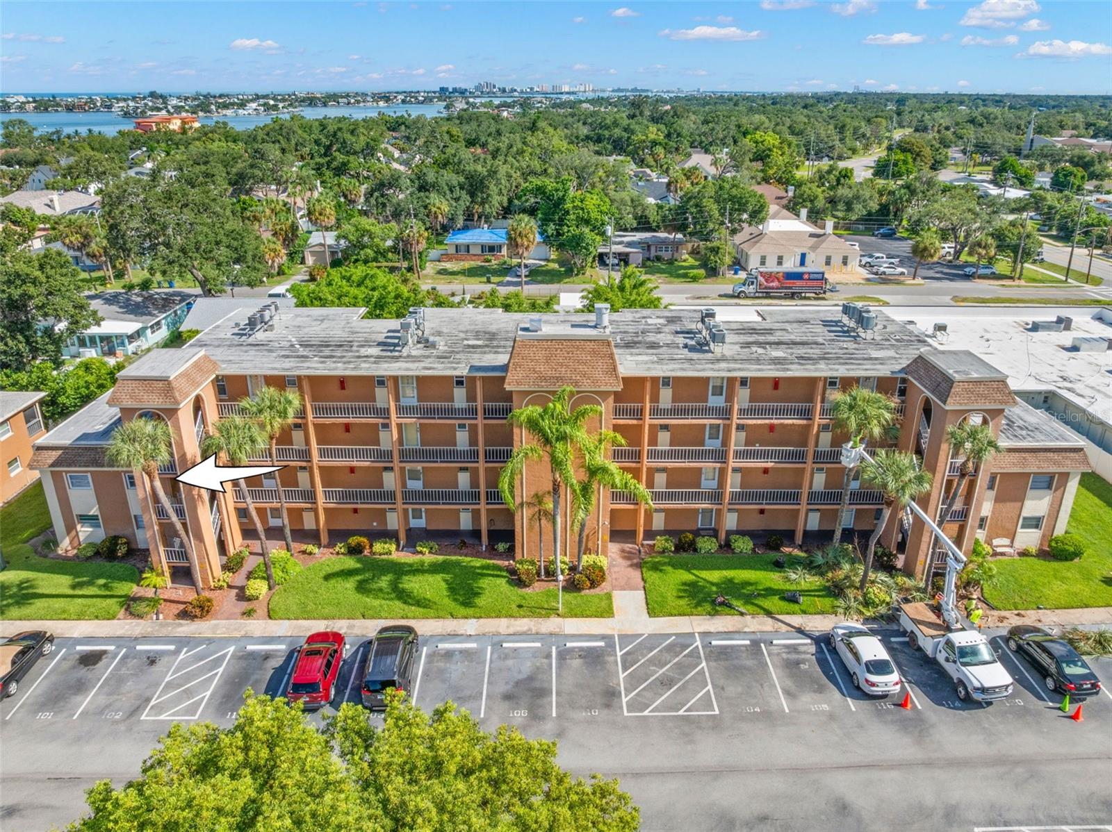 Positioned at the end of the building 1, the 2-bedroom condo benefits from an end-unit location, with mature landscaping surrounding the community.
