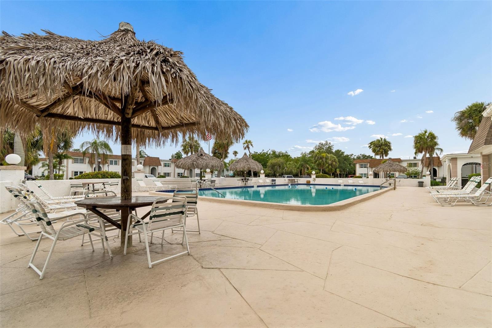 Community Pool & Covered Thatched Umbrellas