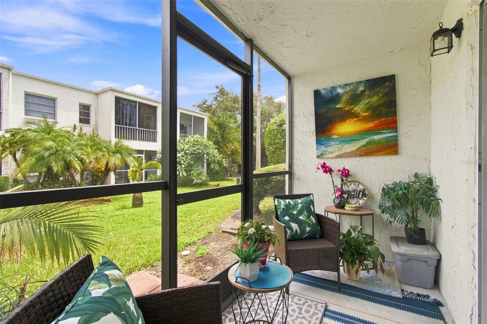 Covered/Screened Lanai with view of courtyard