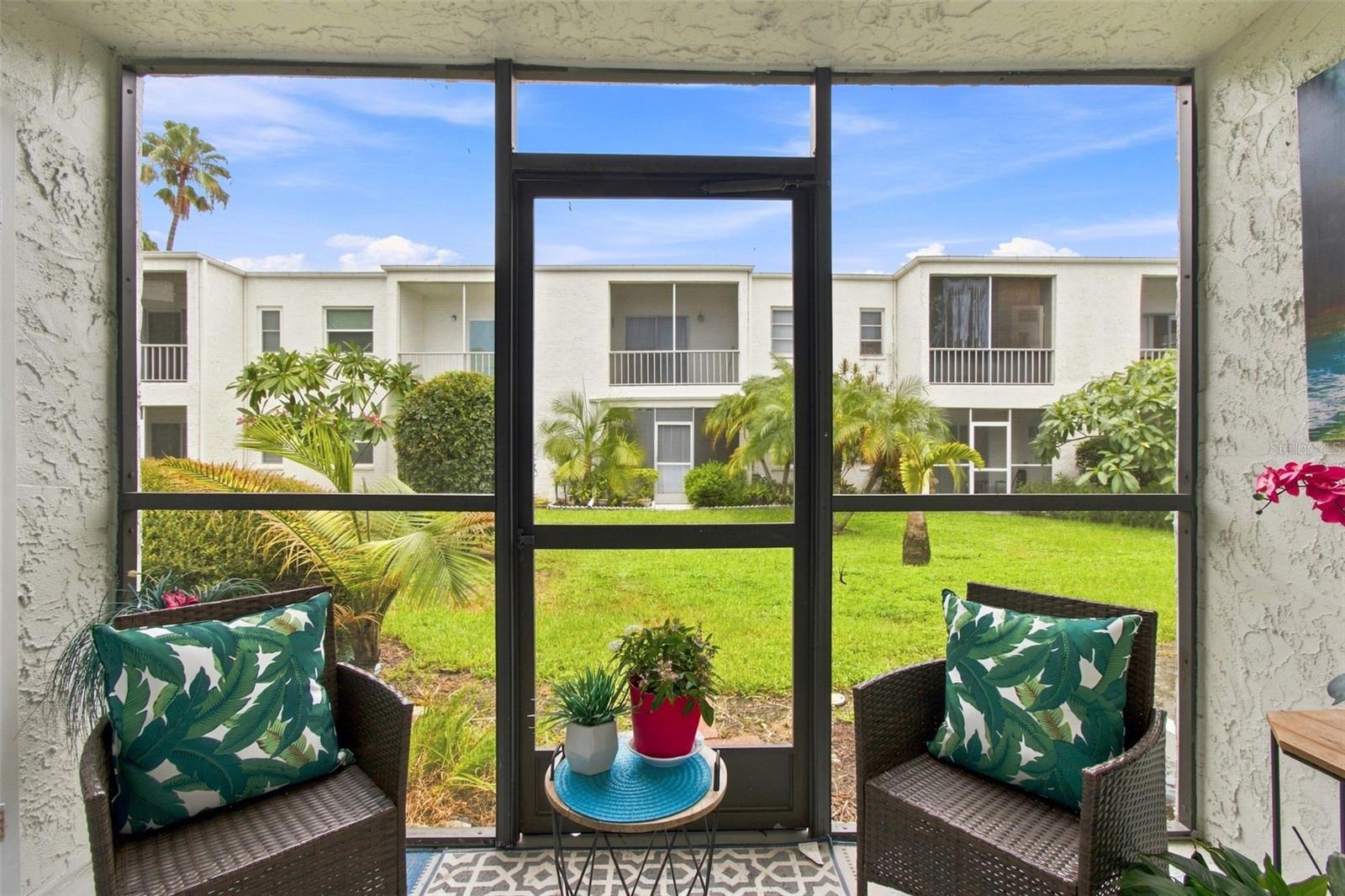 Covered/Screened Lanai with view of courtyard