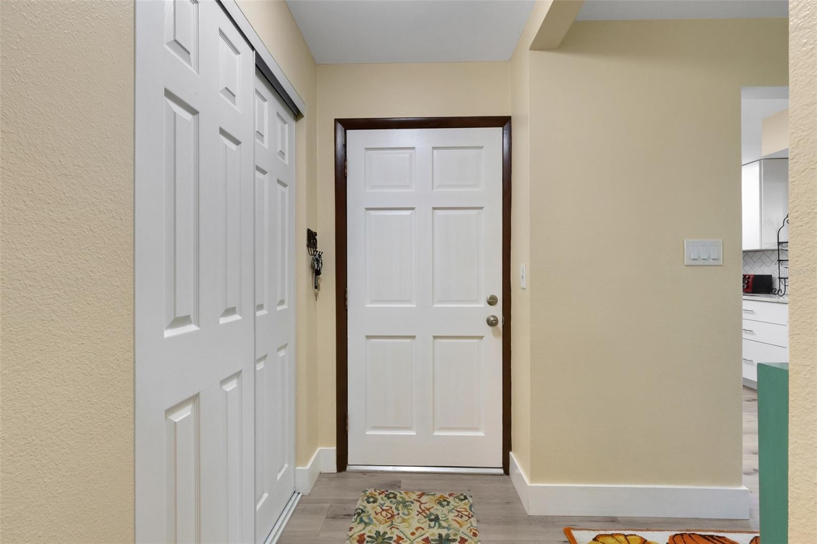 Entryway with Kitchen and Living Areas to the Right Entryway with Kitchen and Living Areas to the Right