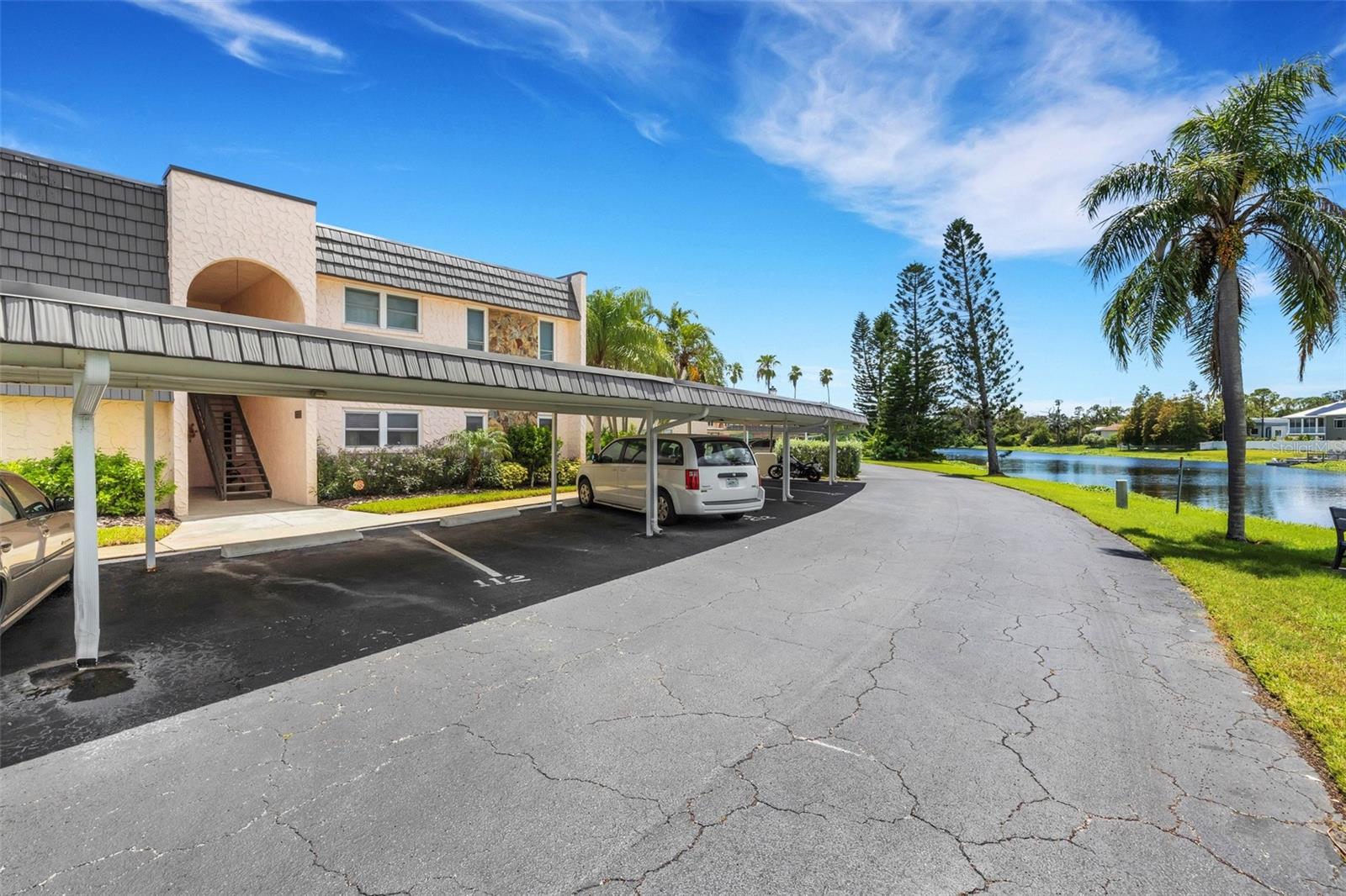 Front of Building with 2 Covered Parking Spaces at Your Front Door