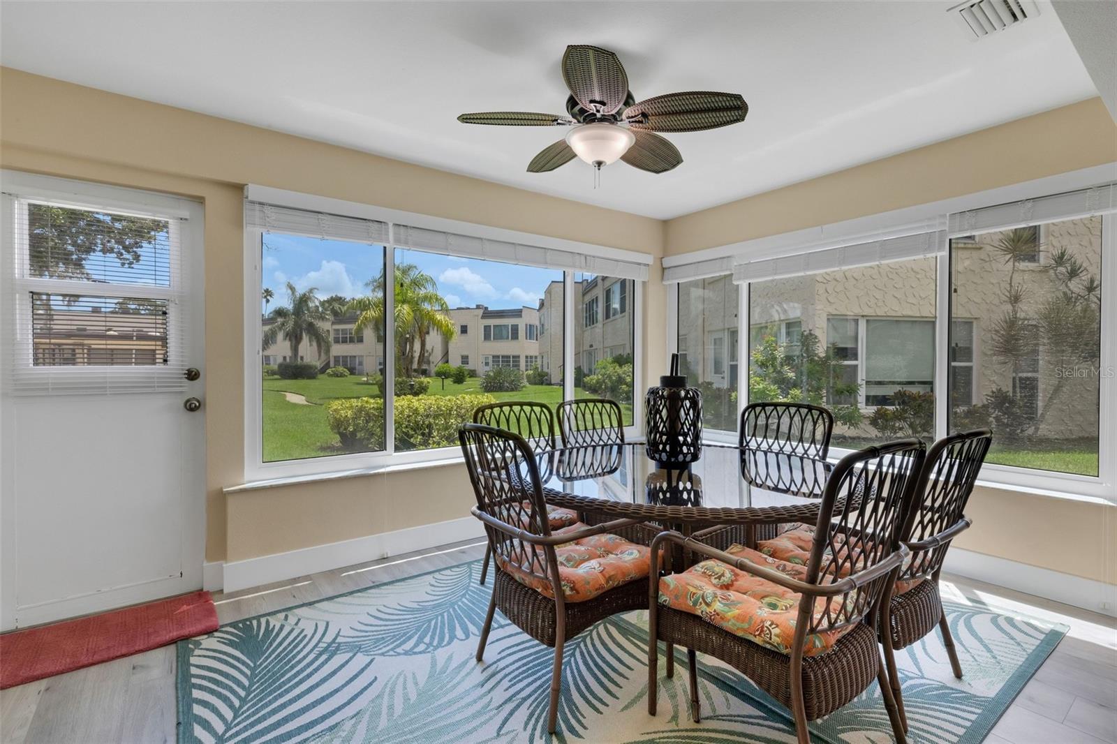 Florida Room with Pedestrian Door to Walkway to Pool and Clobhouse