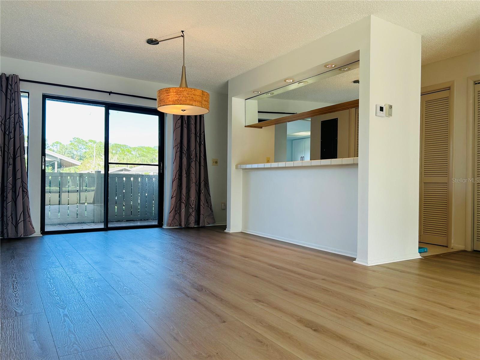 Dining room with breakfast bar and inside laundry closet