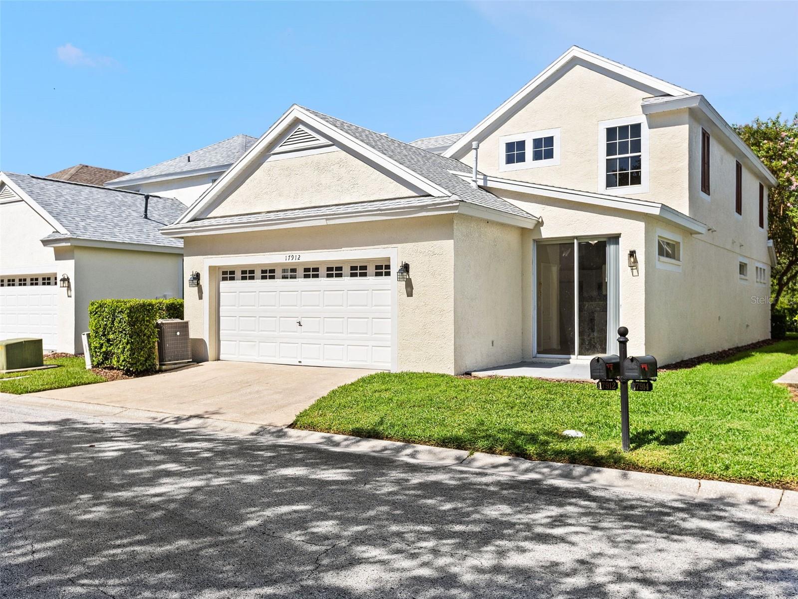 Back garage and sliding glass entrance